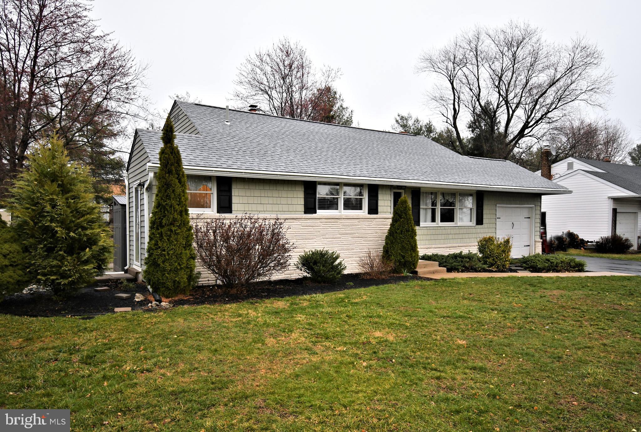 701 Cypress Road Warminster, PA 18974 - Photo 2 of 52 a front view of a house with a garden
