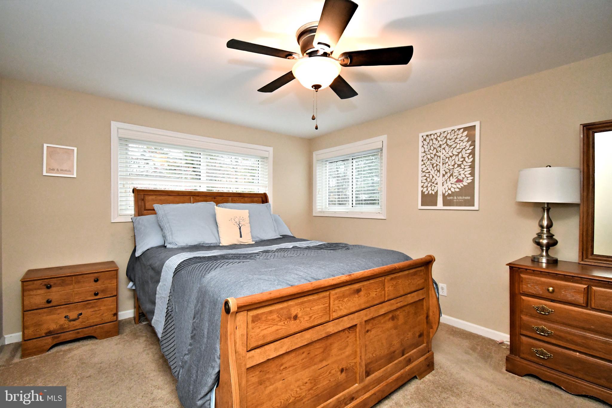 701 Cypress Road Warminster, PA 18974 - Photo 23 of 52 a bedroom with a bed and a chandelier