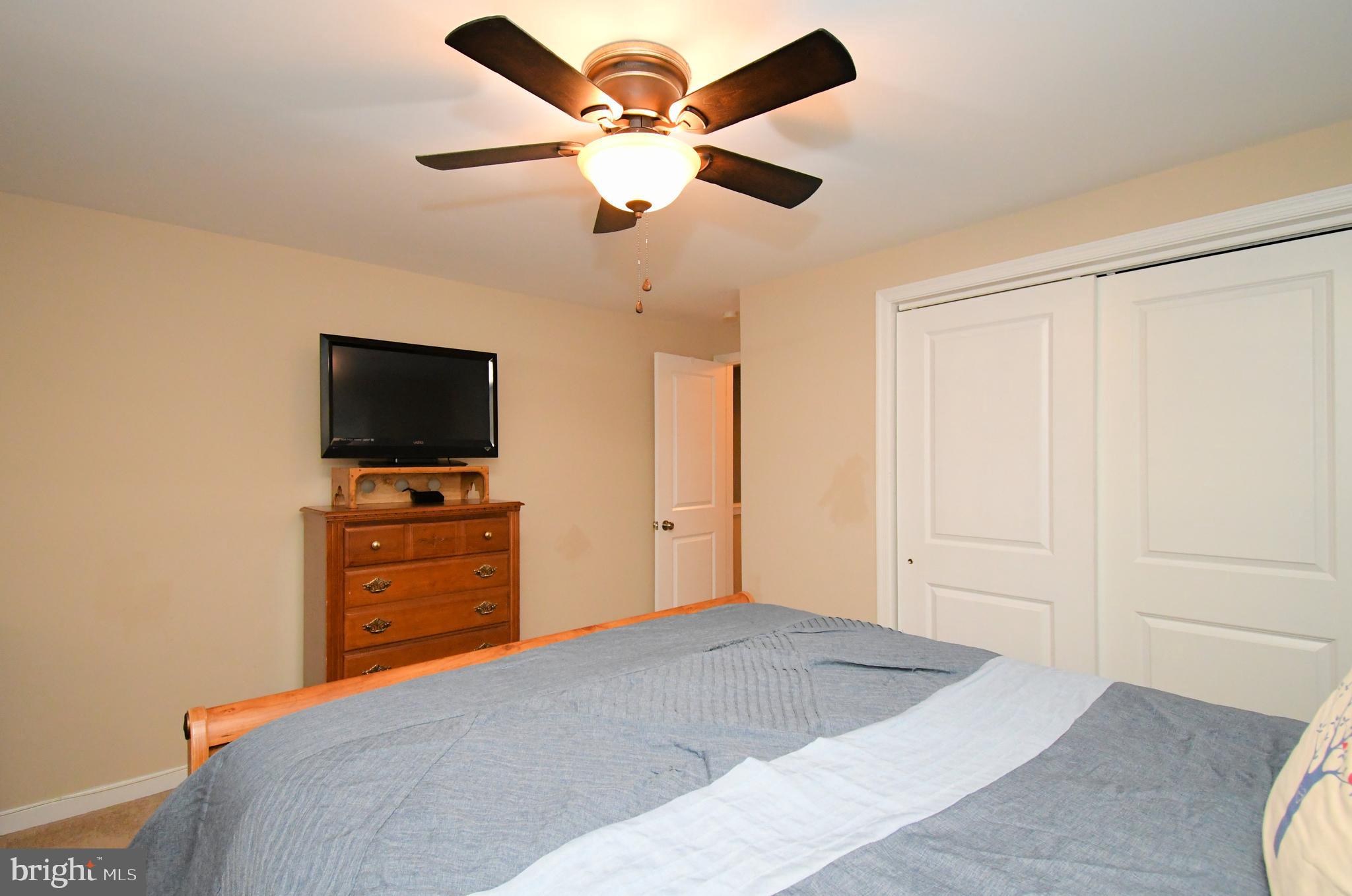 701 Cypress Road Warminster, PA 18974 - Photo 24 of 52 a bedroom with a bed and a flat screen tv