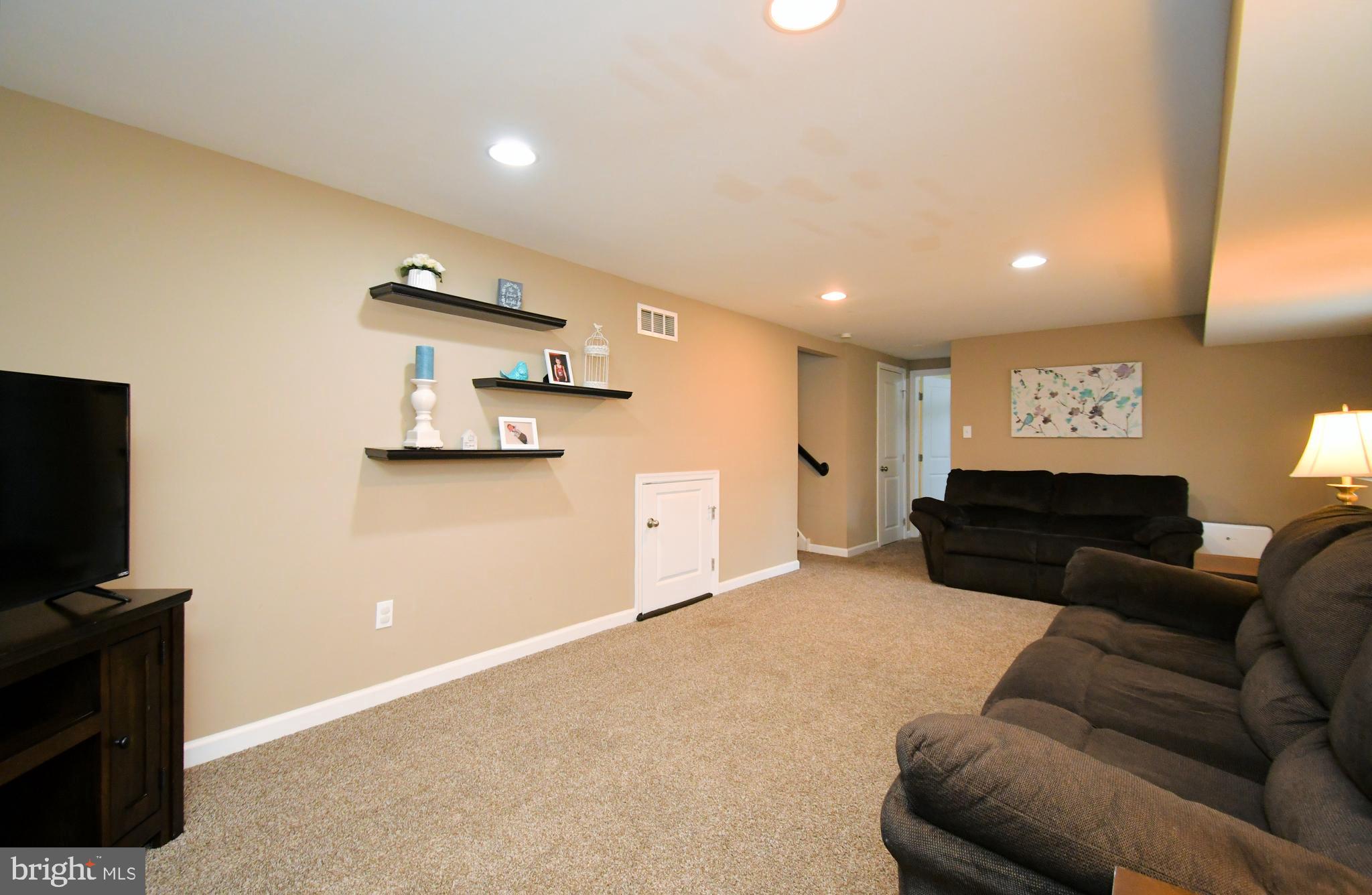 701 Cypress Road Warminster, PA 18974 - Photo 35 of 52 a living room with furniture and a flat screen tv