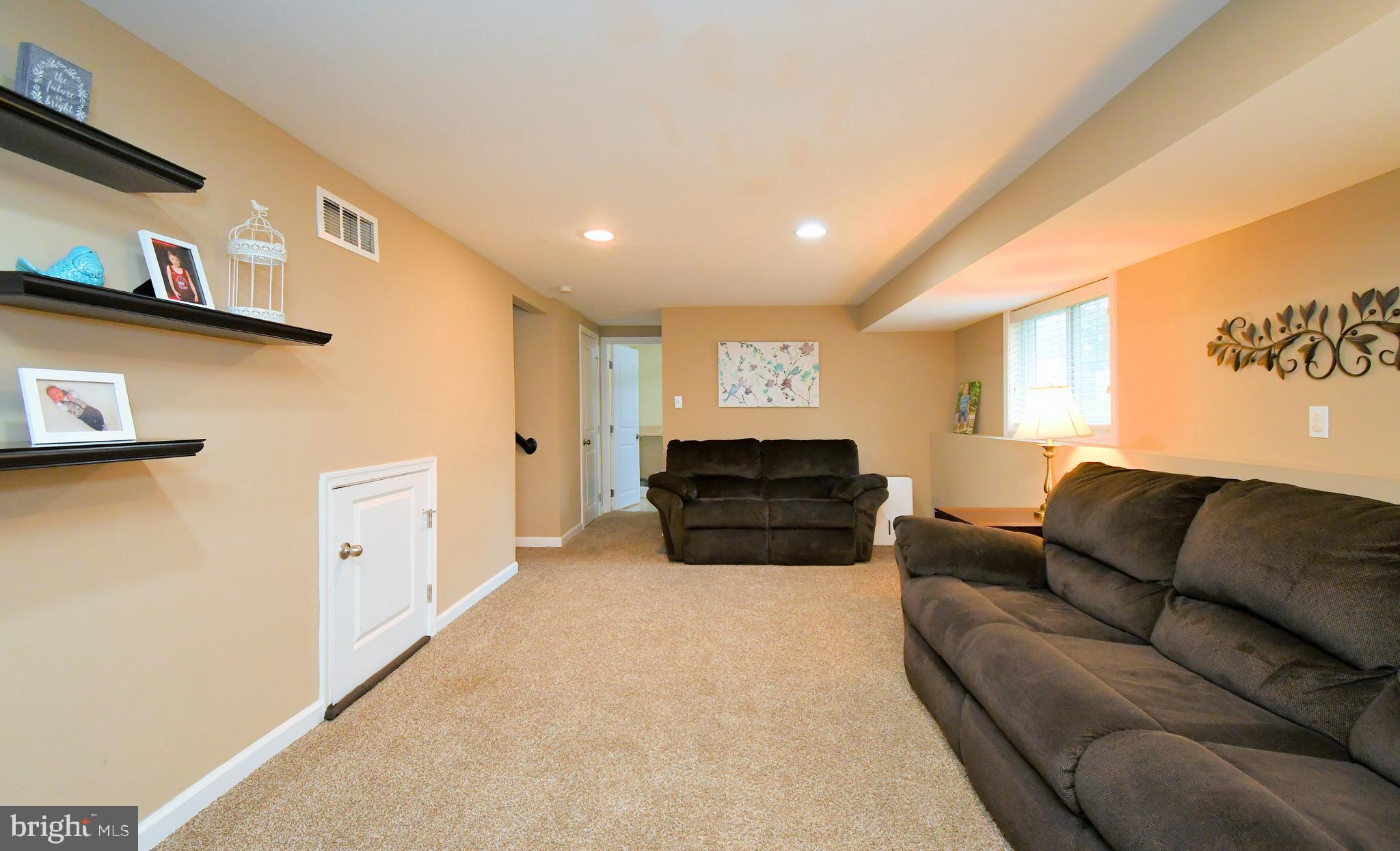 701 Cypress Road Warminster, PA 18974 - Photo 36 of 52 a living room with furniture a couch and a large window
