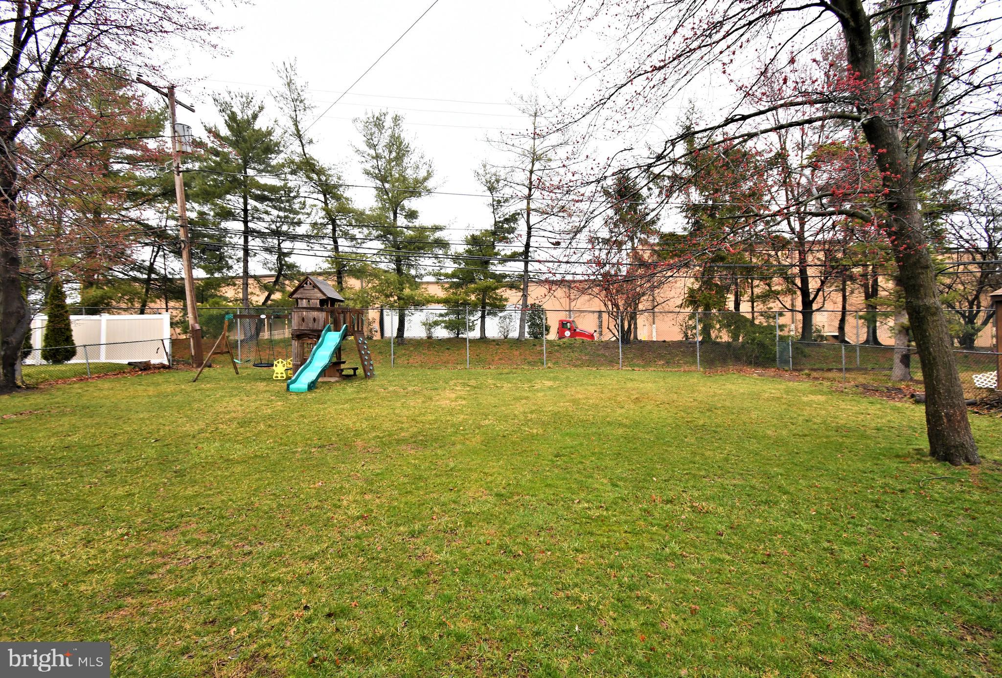 701 Cypress Road Warminster, PA 18974 - Photo 44 of 52 a view of a yard with a tree