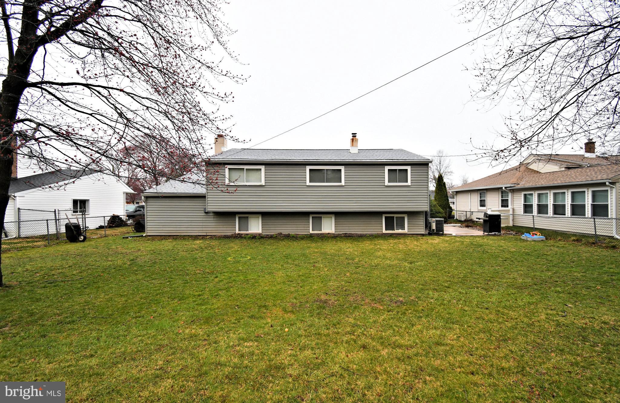 701 Cypress Road Warminster, PA 18974 - Photo 51 of 52 a view of a house with a big yard and large tree
