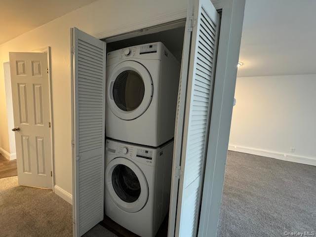 4 Sylcox Road Cornwall, NY 12518 - Photo 11 of 40 Laundry room featuring dark colored carpet and estacked washer and dryer