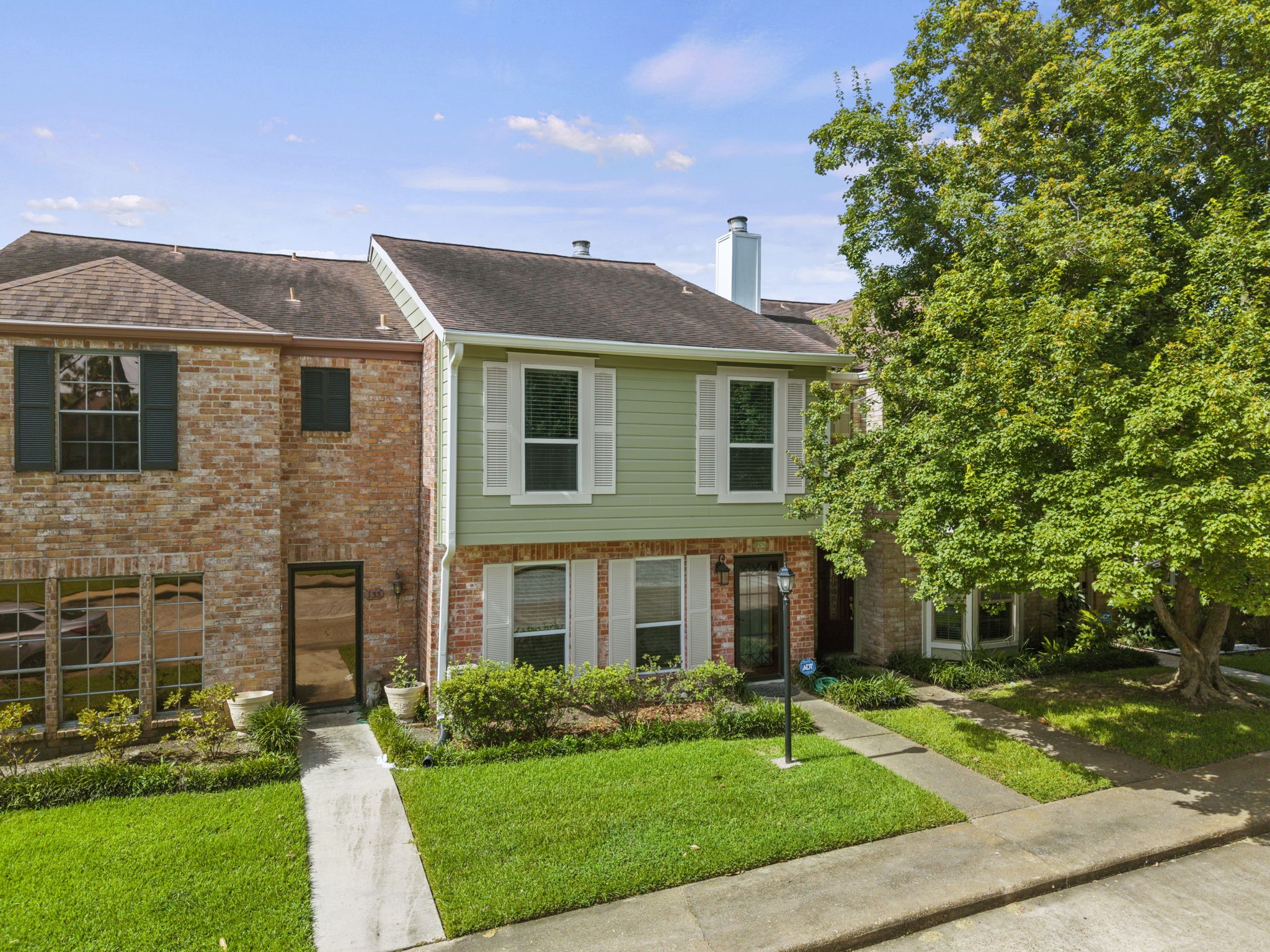 5801 Lumberdale Road, Unit 132 Houston, TX 77092 - Photo 2 of 33 Front of the home with beautifully maintained landscaping