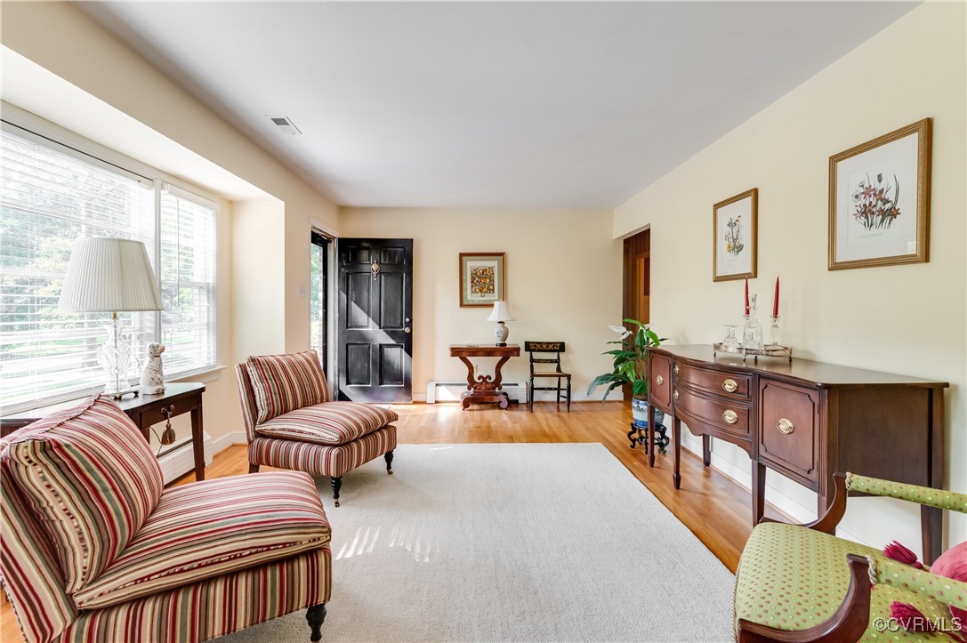 208 Tamarack Road Henrico, VA 23229 - Photo 19 of 35 a living room with furniture a fireplace and a large window
