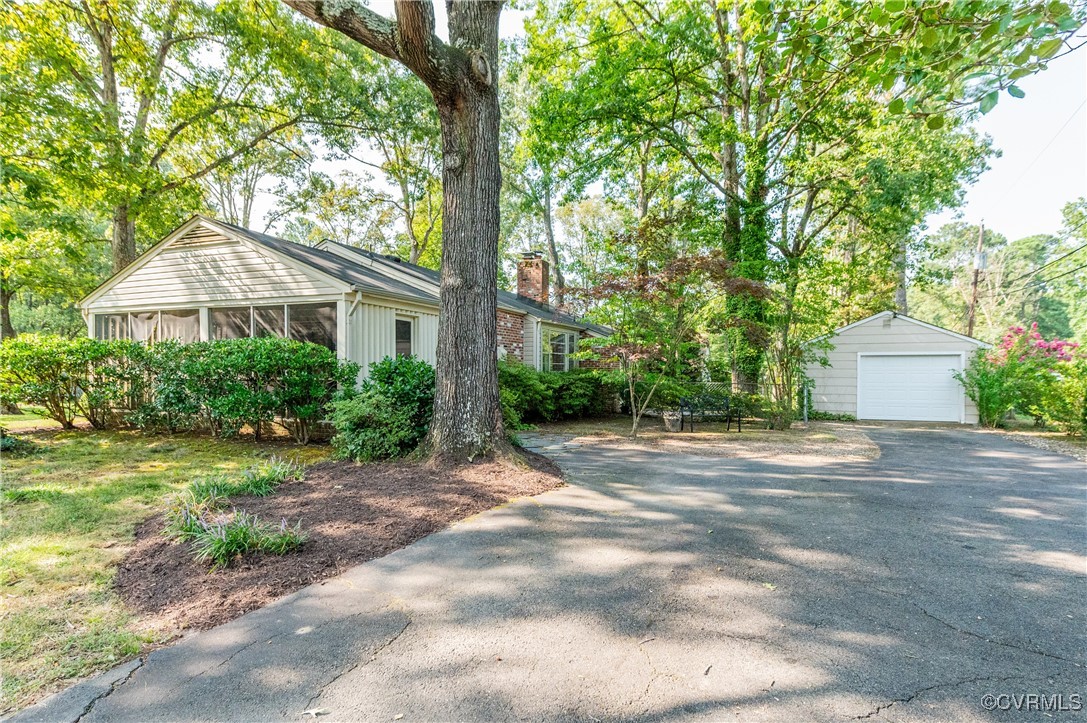 208 Tamarack Road Henrico, VA 23229 - Photo 3 of 35 a front view of a house with a garden