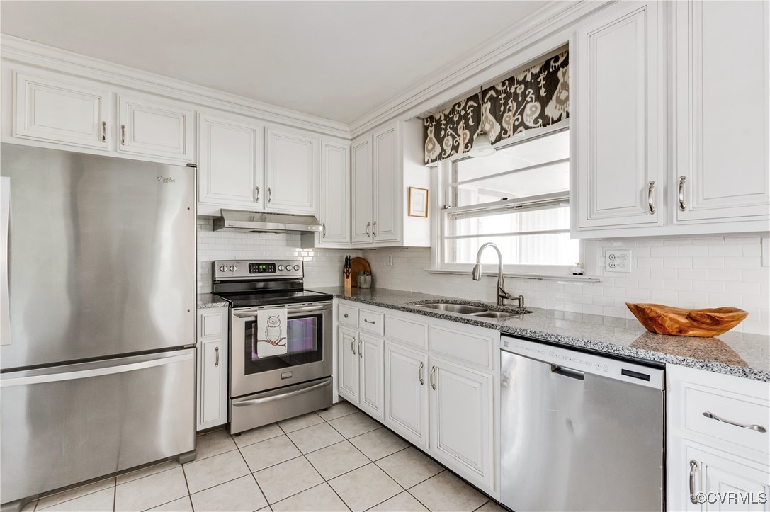 208 Tamarack Road Henrico, VA 23229 - Photo 10 of 35 a kitchen with stainless steel appliances granite countertop a refrigerator sink and white cabinets