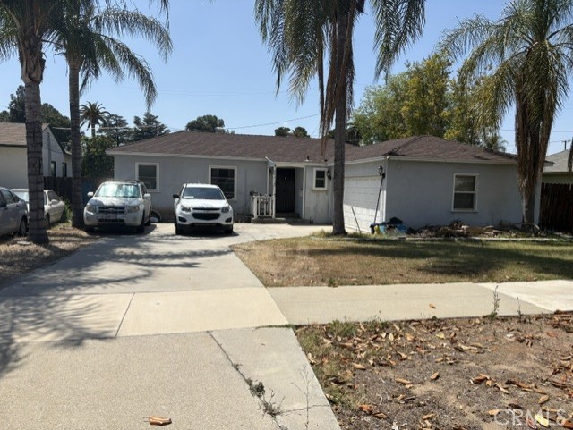 6041 Hamilton Drive Riverside, CA 92506 - Photo 1 of 3 a front view of a house with a yard