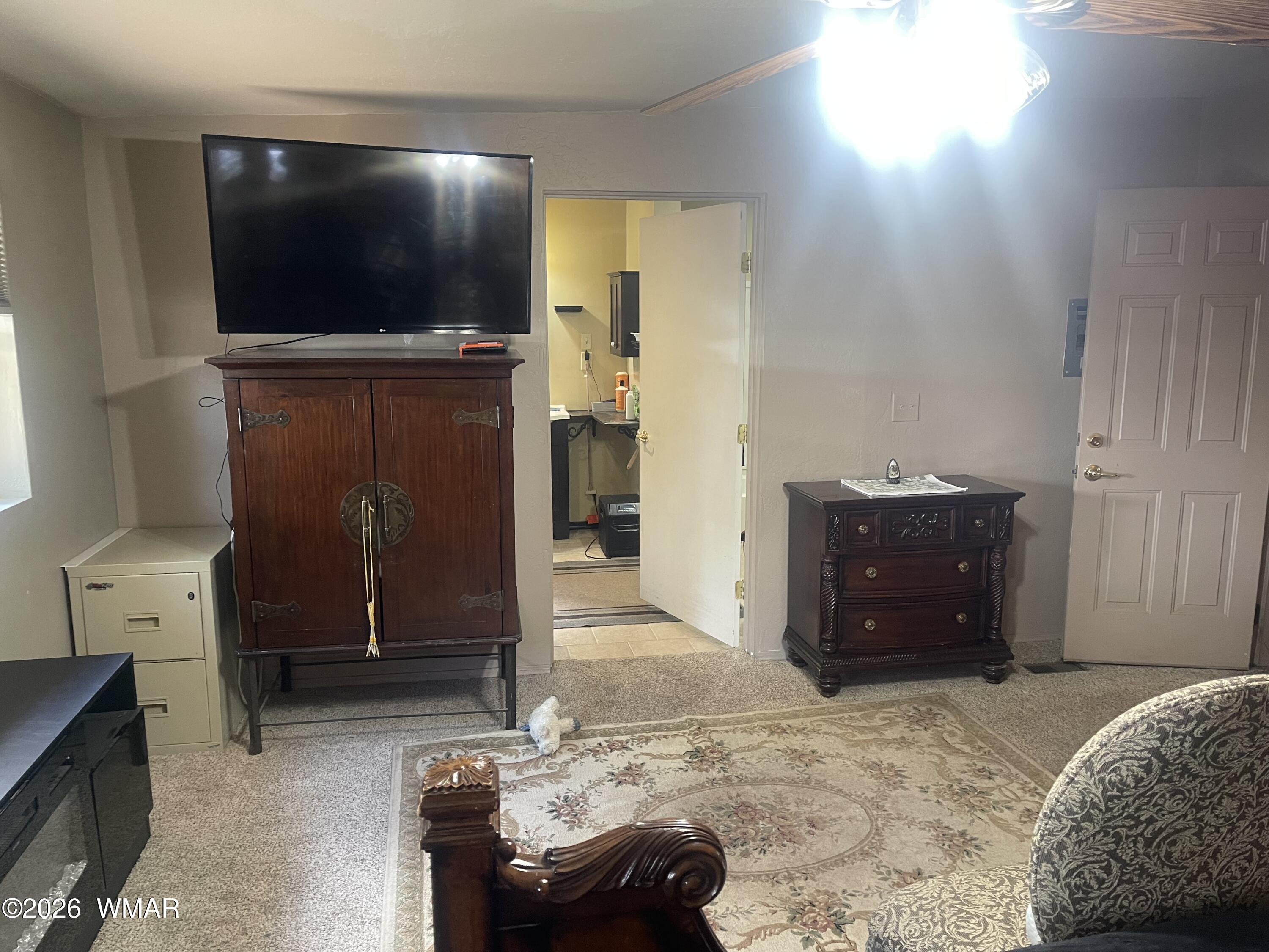 2871 Moose Trail Overgaard, AZ 85933 - Photo 16 of 25 a living room with furniture and a flat screen tv