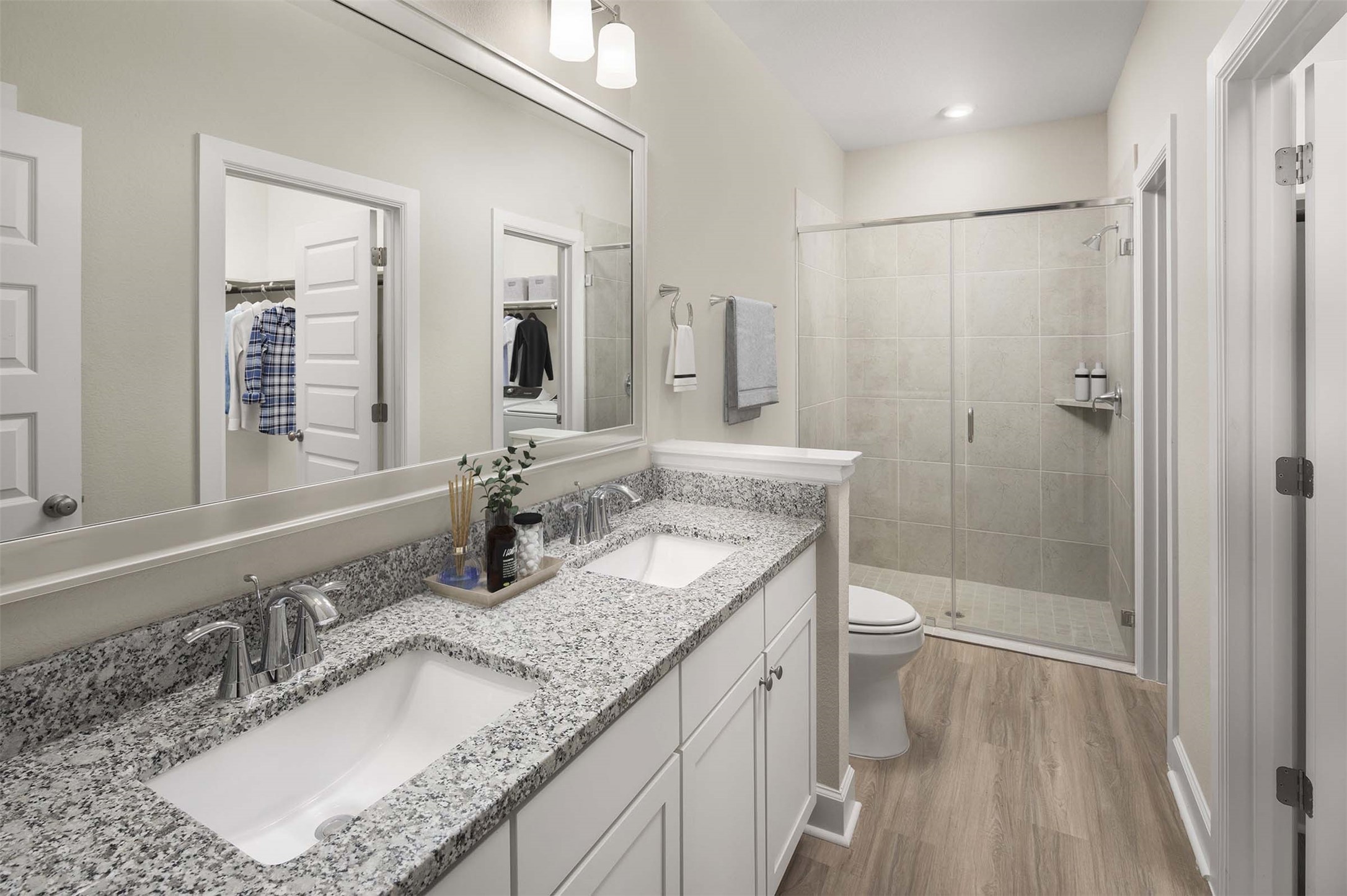 1840 Woodland Field Crossing, Unit 207 Spring, TX 77380 - Photo 11 of 15 a bathroom with a granite countertop sink a mirror a toilet and shower