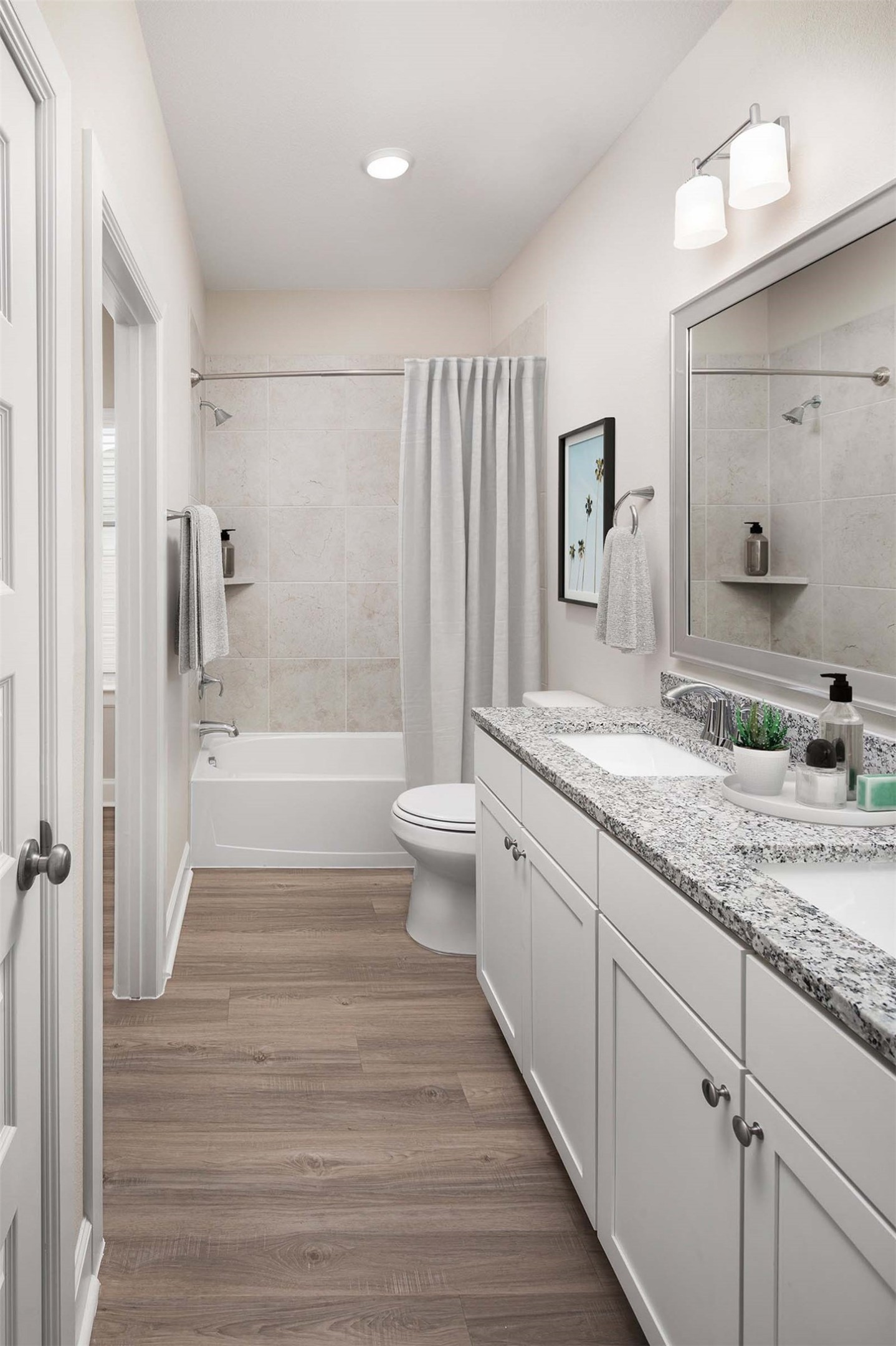 1840 Woodland Field Crossing, Unit 207 Spring, TX 77380 - Photo 9 of 15 a bathroom with a granite countertop sink toilet and shower