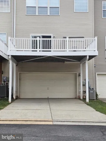a view of a balcony with barbeque area