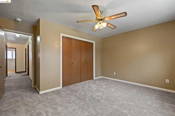 a view of a livingroom with a ceiling fan