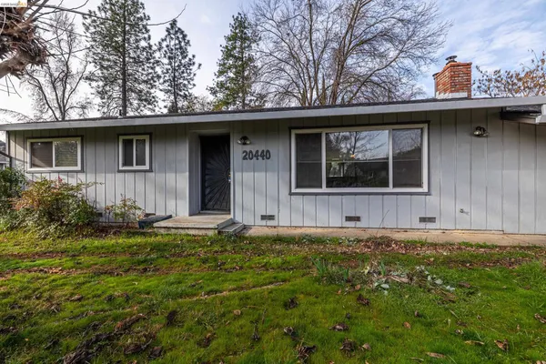 a house with trees in the background