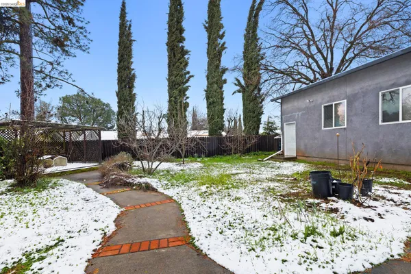 a view of a backyard with a patio