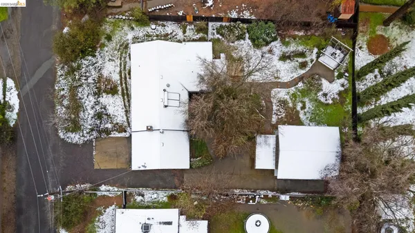 an aerial view of a house with yard