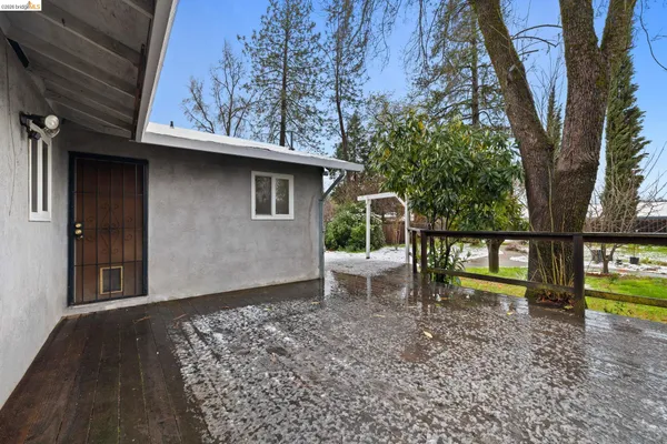 a house view with a bench