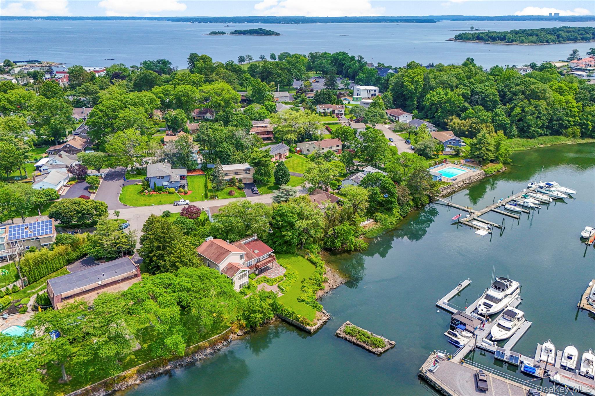 31 Clover Place New Rochelle, NY 10805 - Photo 1 of 44 a view of a house with a yard and street