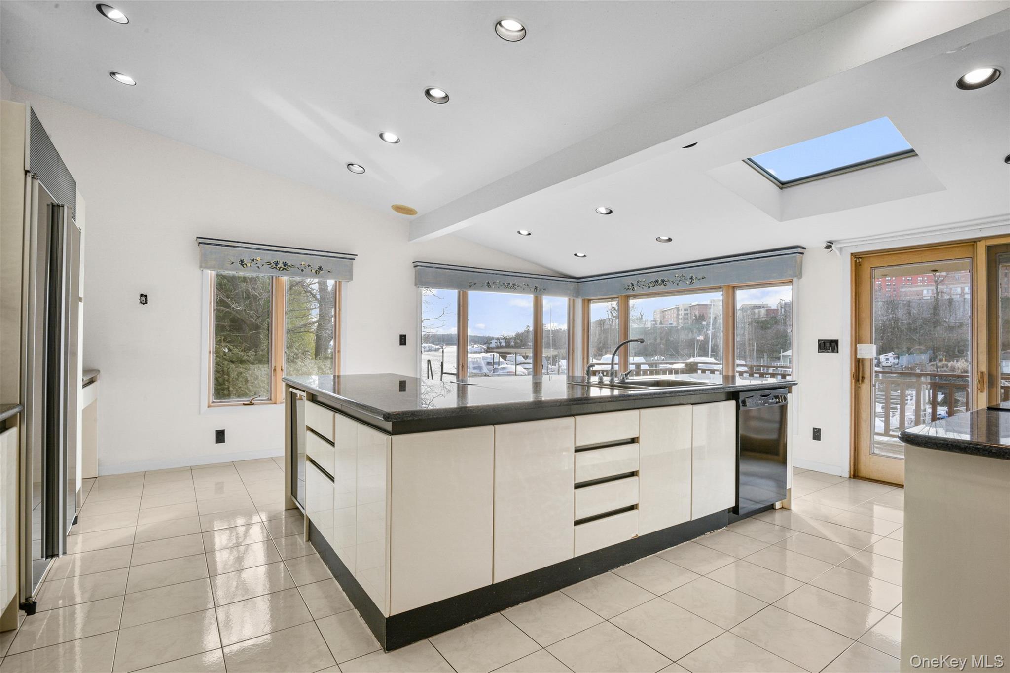 31 Clover Place New Rochelle, NY 10805 - Photo 12 of 44 a kitchen with granite countertop a sink and cabinets