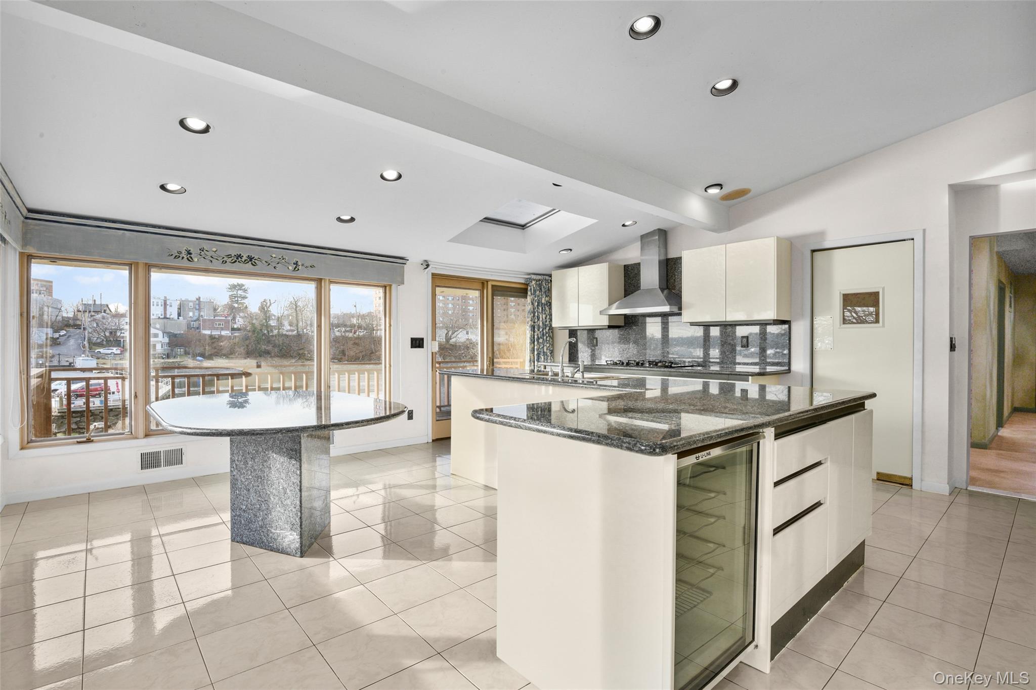 31 Clover Place New Rochelle, NY 10805 - Photo 14 of 44 a kitchen with stainless steel appliances granite countertop a stove and a sink