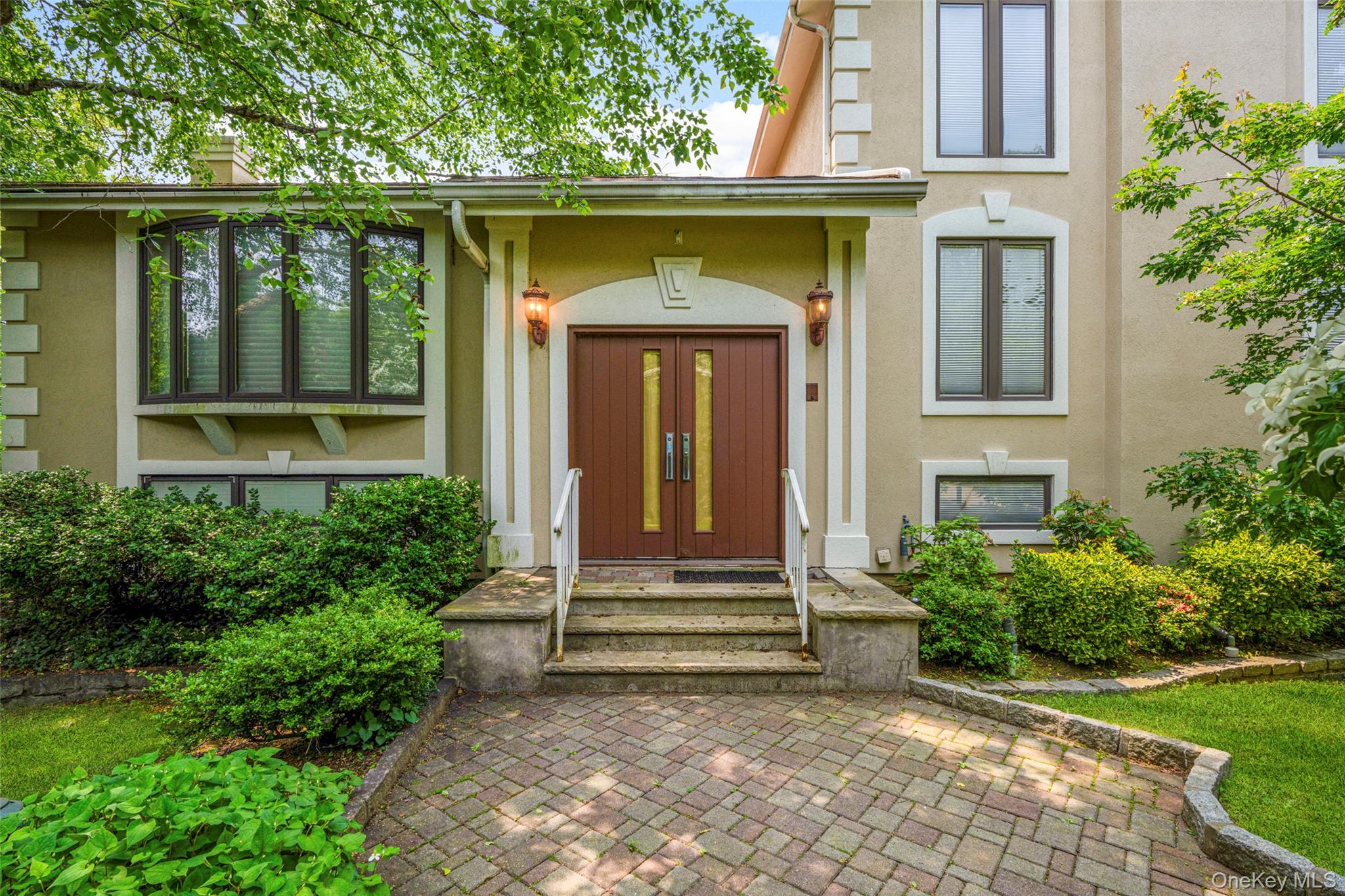31 Clover Place New Rochelle, NY 10805 - Photo 2 of 44 a front view of a house with a yard