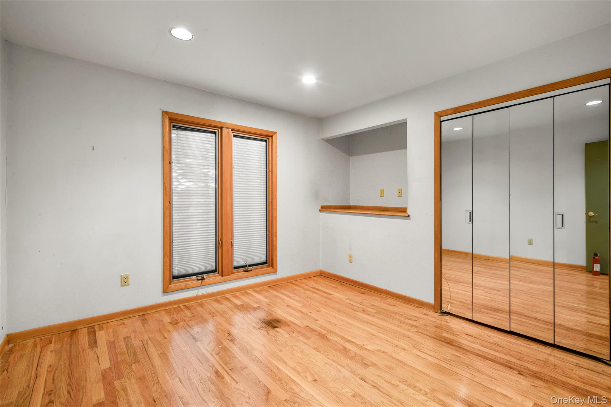 31 Clover Place New Rochelle, NY 10805 - Photo 25 of 44 a view of an empty room with wooden floor