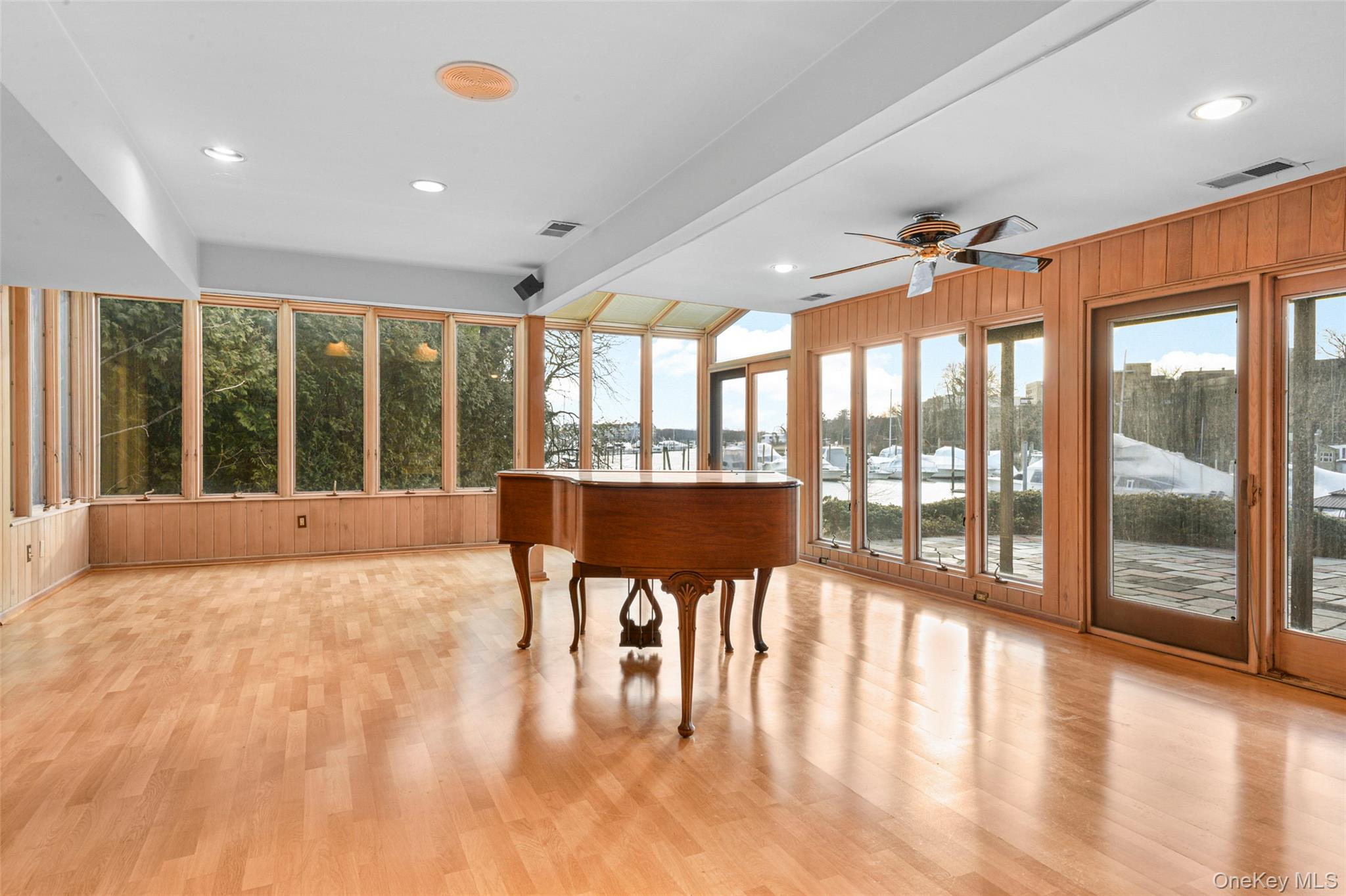 31 Clover Place New Rochelle, NY 10805 - Photo 29 of 44 a view of an empty room with wooden floor and windows