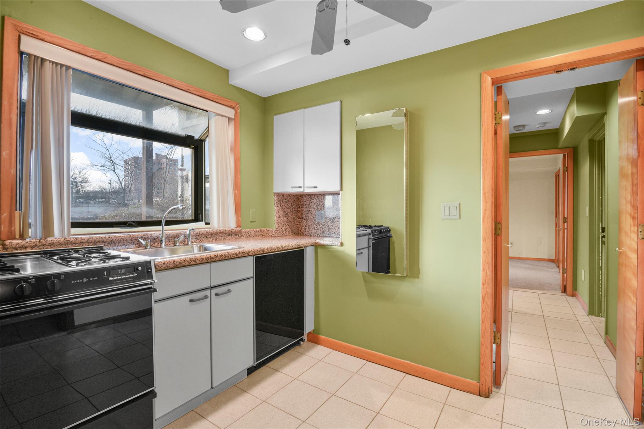 31 Clover Place New Rochelle, NY 10805 - Photo 32 of 44 a kitchen with a sink and a refrigerator