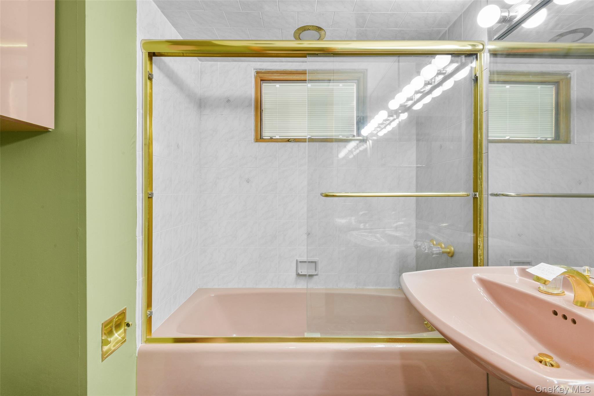 31 Clover Place New Rochelle, NY 10805 - Photo 37 of 44 a bathroom with a tub and shower