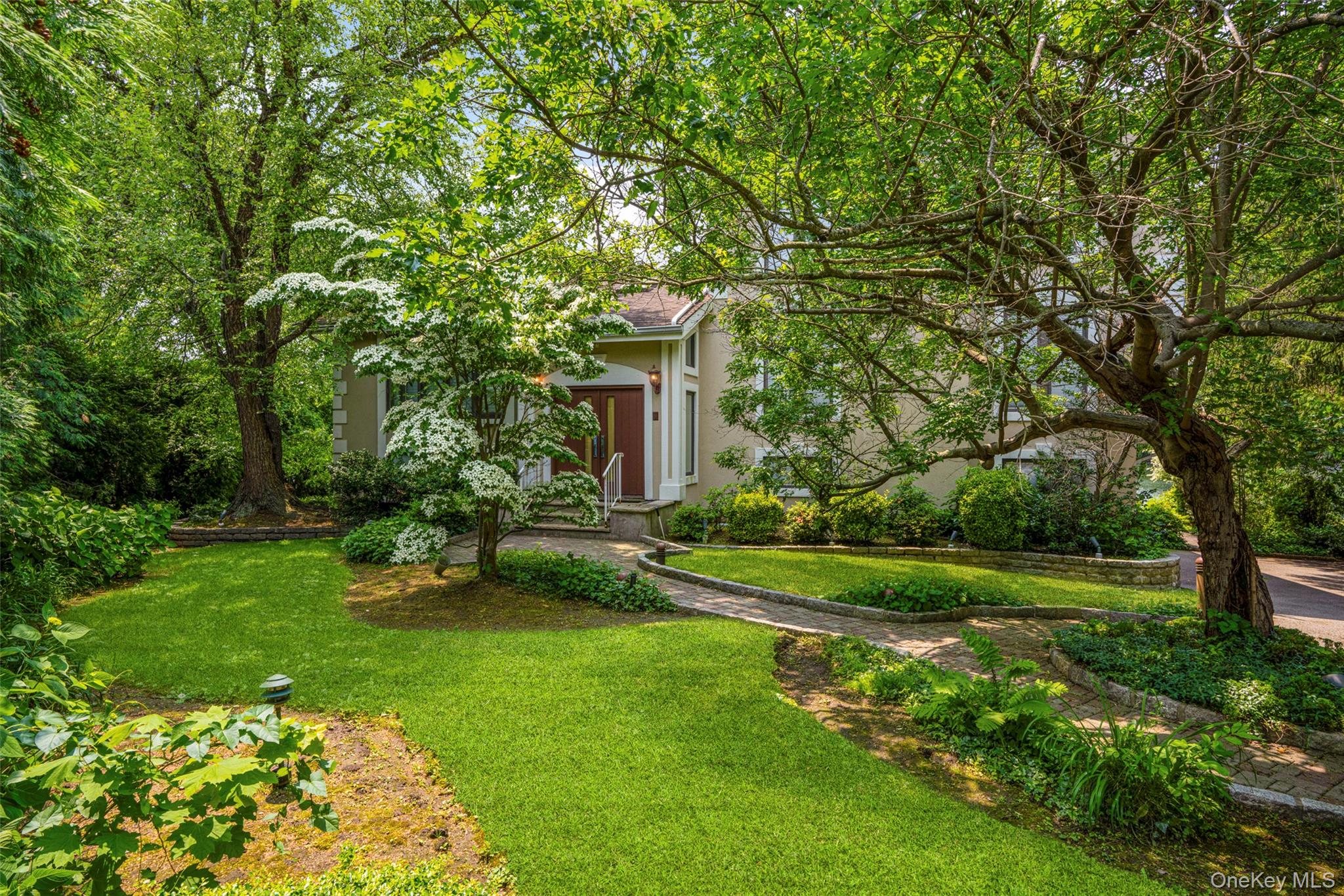 31 Clover Place New Rochelle, NY 10805 - Photo 38 of 44 a view of a house with a yard and sitting area