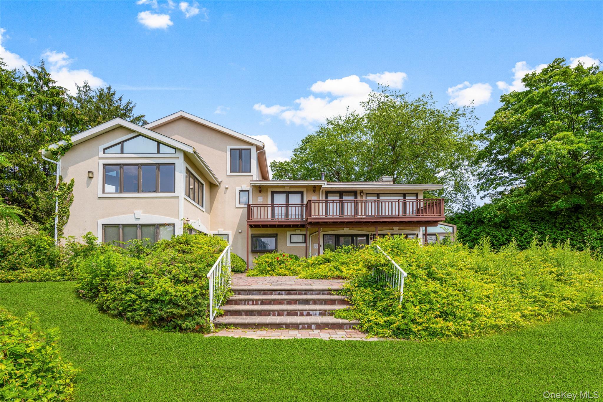 31 Clover Place New Rochelle, NY 10805 - Photo 4 of 44 a front view of a house with a yard