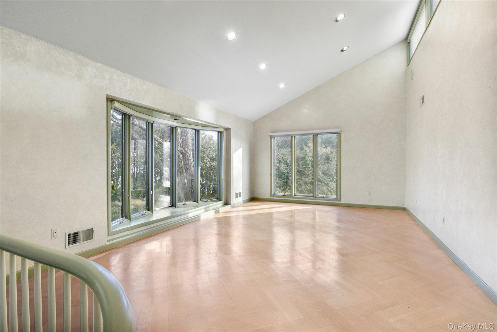 31 Clover Place New Rochelle, NY 10805 - Photo 8 of 44 a view of an empty room with wooden floor and a window
