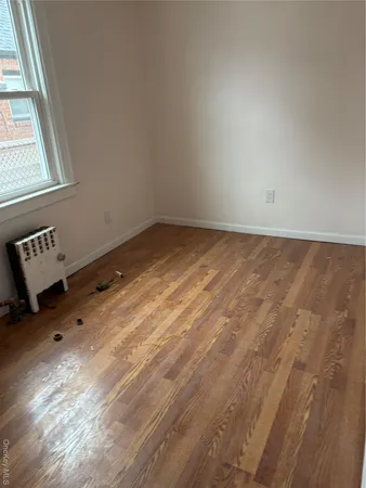 a view of an empty room and a window