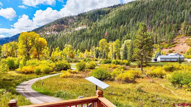a view of swimming pool from a lake view