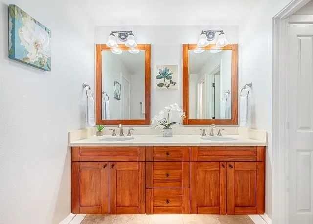 a bathroom with a double vanity sink and a mirror