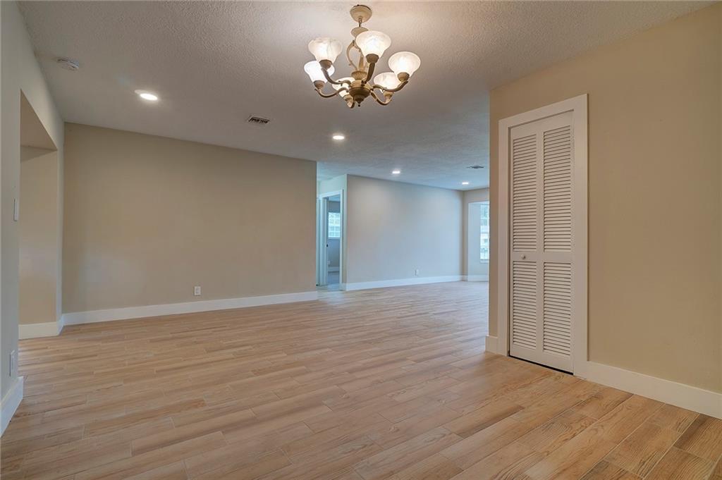 6711 Northwest 8th Street Margate, FL 33063 - Photo 12 of 25 a view of an empty room with wooden floor