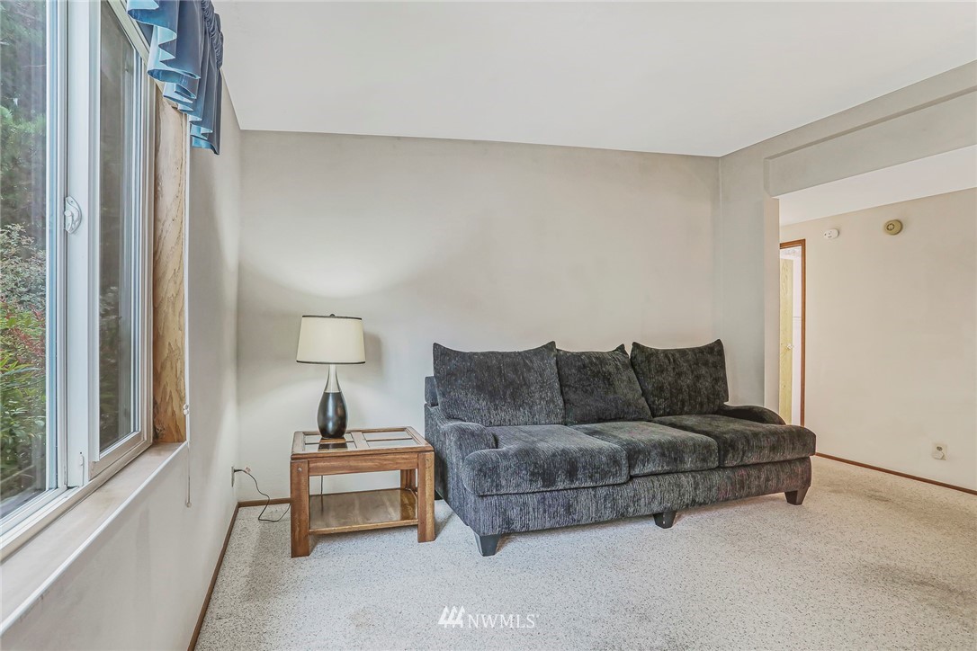 930 243rd Street Southwest Bothell, WA 98021 - Photo 11 of 37 a living room with furniture and a window
