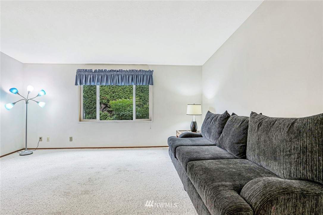 930 243rd Street Southwest Bothell, WA 98021 - Photo 12 of 37 a living room with furniture and a large window