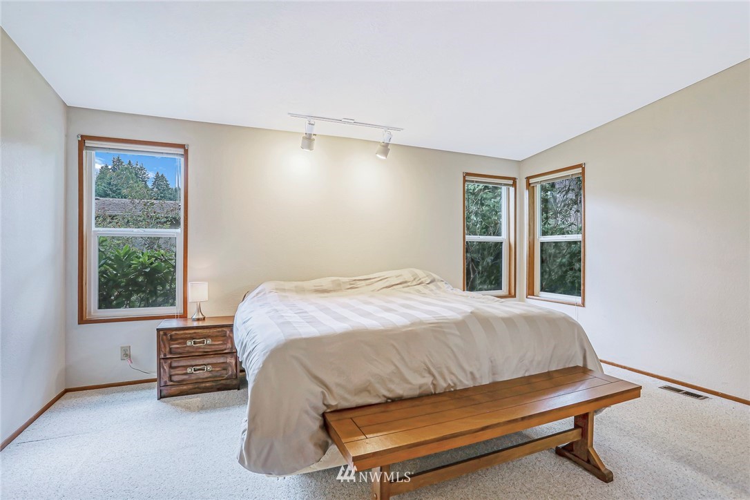 930 243rd Street Southwest Bothell, WA 98021 - Photo 15 of 37 a bedroom with a bed and a window