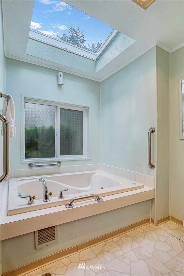 930 243rd Street Southwest Bothell, WA 98021 - Photo 18 of 37 a bathroom with a bathtub and a sink