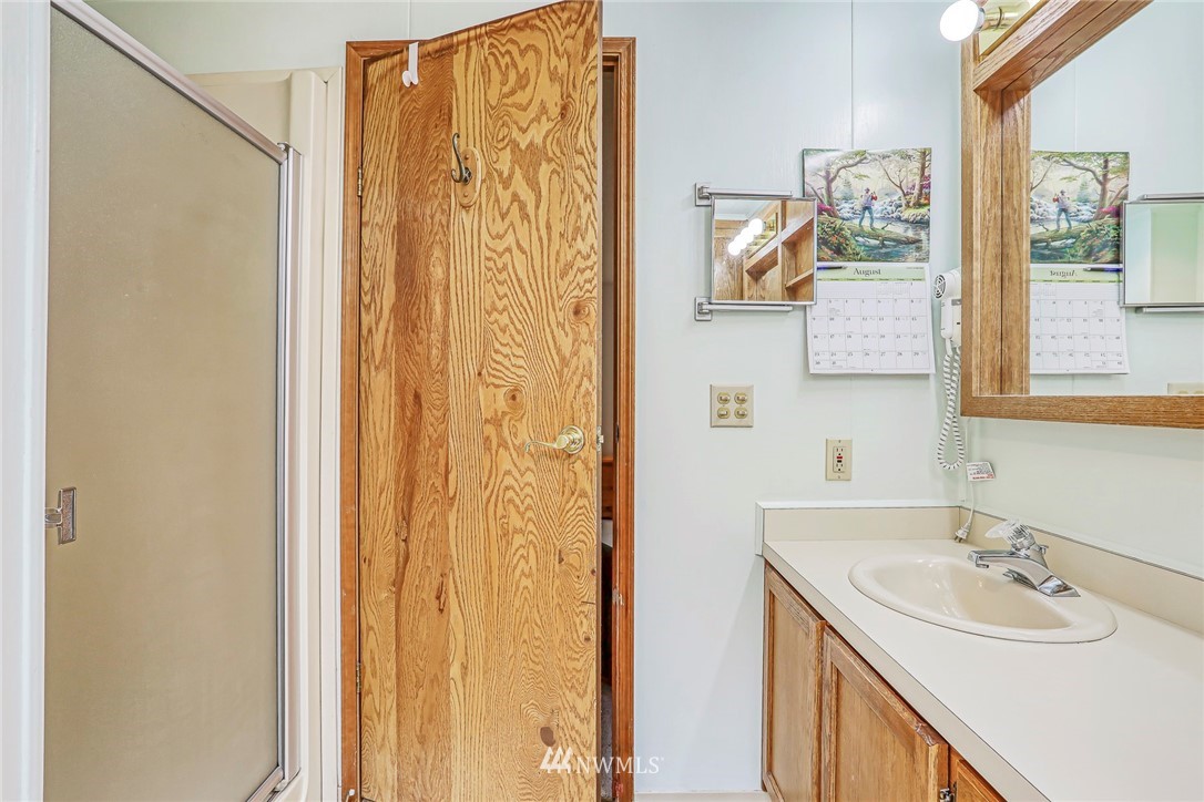 930 243rd Street Southwest Bothell, WA 98021 - Photo 20 of 37 a bathroom with a sink and a mirror