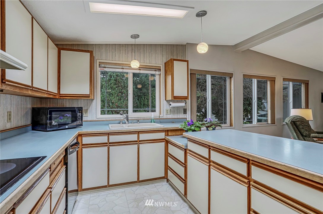 930 243rd Street Southwest Bothell, WA 98021 - Photo 3 of 37 a kitchen with sink and large window