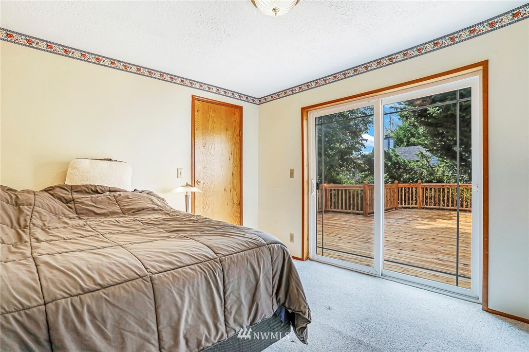 930 243rd Street Southwest Bothell, WA 98021 - Photo 21 of 37 a bedroom with a bed and with a large window