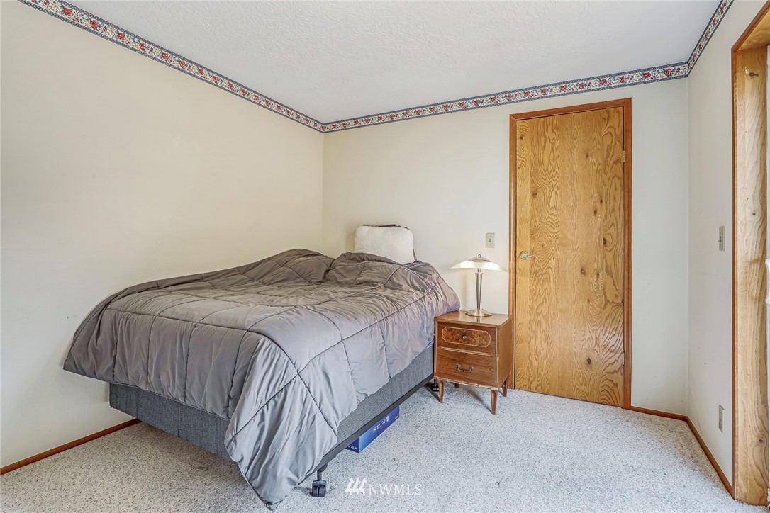930 243rd Street Southwest Bothell, WA 98021 - Photo 22 of 37 a bedroom with a bed and a shower