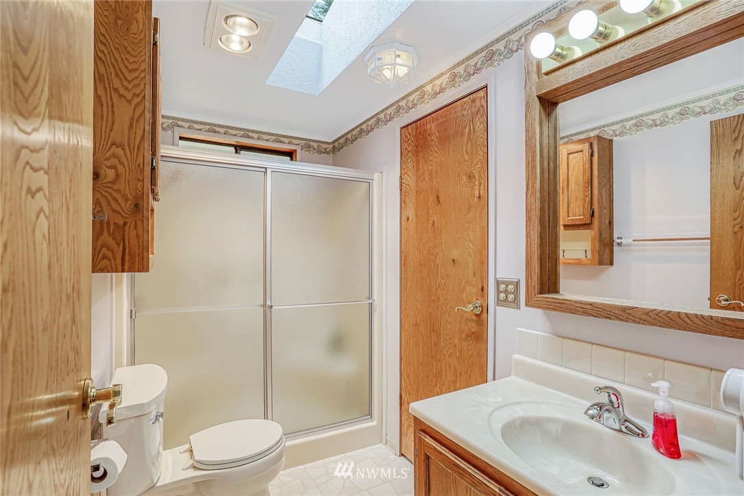 930 243rd Street Southwest Bothell, WA 98021 - Photo 23 of 37 a bathroom with a sink toilet and shower