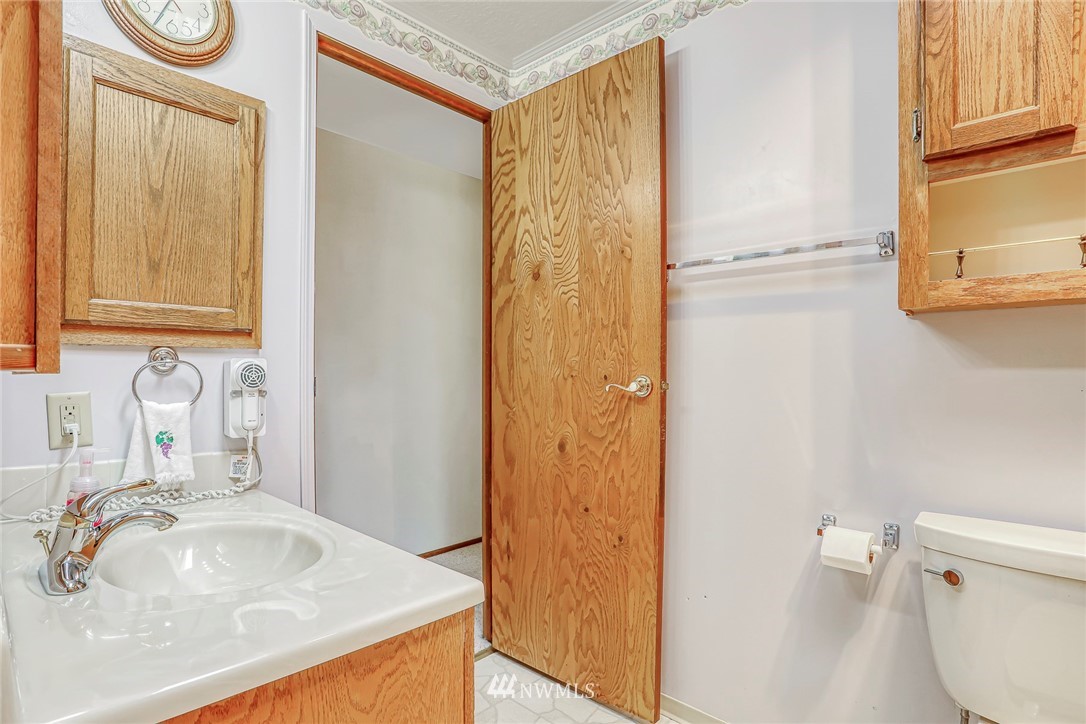 930 243rd Street Southwest Bothell, WA 98021 - Photo 24 of 37 a bathroom with a sink a toilet and shower