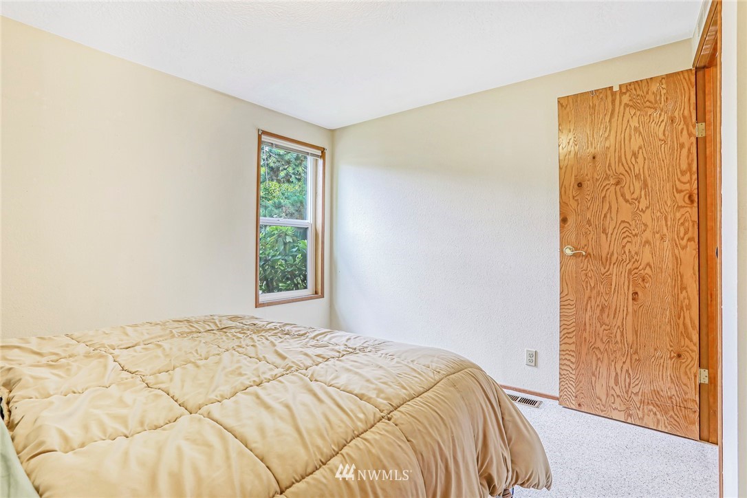 930 243rd Street Southwest Bothell, WA 98021 - Photo 27 of 37 a bedroom with a bed and a window