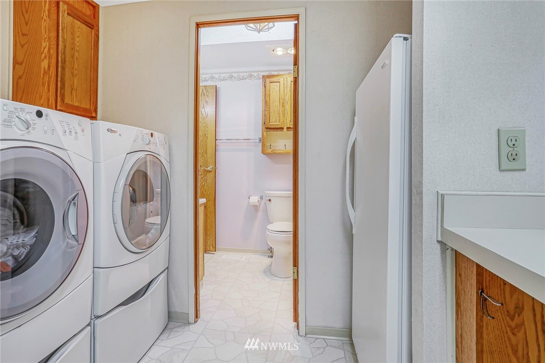 930 243rd Street Southwest Bothell, WA 98021 - Photo 29 of 37 a utility room with dryer and washer