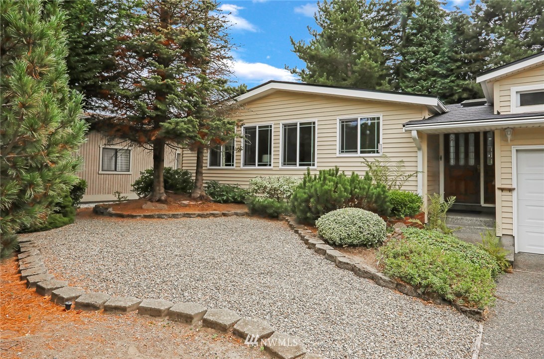 930 243rd Street Southwest Bothell, WA 98021 - Photo 32 of 37 a front view of a house with garden